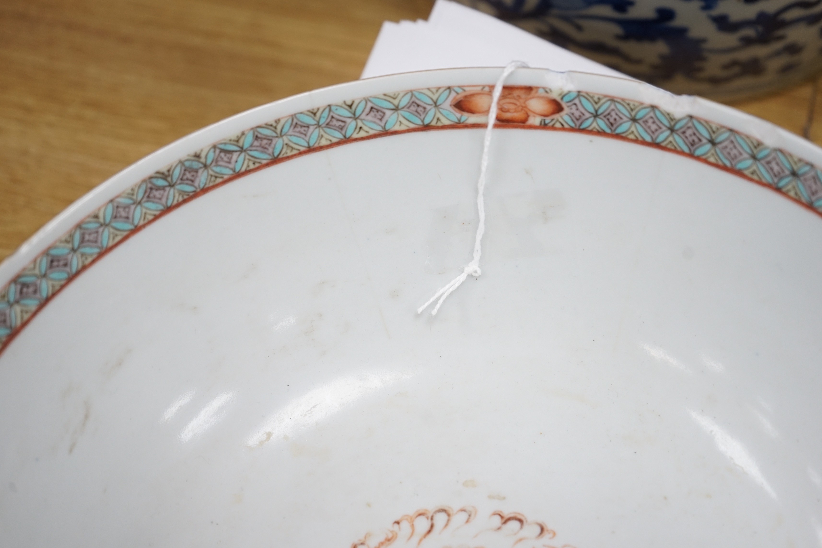 A 19th century Chinese famille verte powder blue bowl, 26cm diameter, wood stand